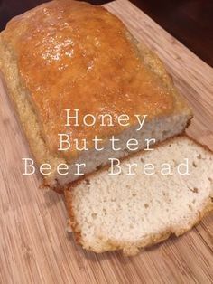 a loaf of honey butter beer bread on a cutting board