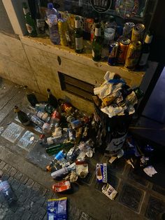 a pile of garbage sitting on the side of a street next to a fire place