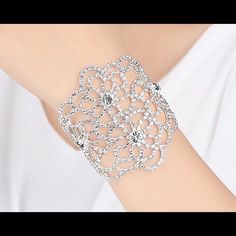 Stunning Silver Tone Crystal Rhinestone Bracelet Features A Lobster Clasp For Ease In Wearing. Can Be Worn With A Wedding Dress, Little Black Dress Or With Your Favorite Jeans. The Intricate Details In This Design Will Help Complete Your Ensemble. Silver Crystal Bracelet With Rhinestones, White Crystal Party Bracelet, Diamond White Crystal Bracelet For Party, Elegant White Crystal Bracelet With Sparkling Stones, Elegant Diamond White Crystal Bracelet For Party, White Cubic Zirconia Crystal Bracelet For Party, Elegant White Crystal Bracelet, White Crystal Bangle Bracelet, White Crystal Bracelet With Rhinestones For Party