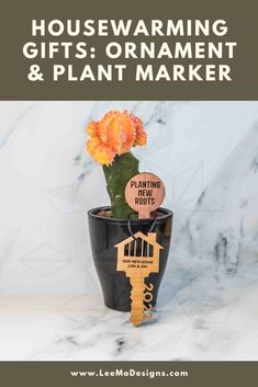 Cedar plant marker saying "planting new roots" in a moon cactus plant, with a cherry wood new home key ornament saying "our new home lisa & jim" on a marble background Housewarming Gifts For Men, Personalized Housewarming Gifts, Trellis Plants, Unique Housewarming Gifts, Garden Markers