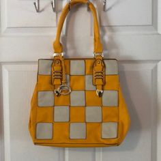 Brand New But No Tags. Bag Measures Approx 15” Across And 22 1/2” From Top Of Strap To Bottom With Gold Hardware. Scuffs From Storage In Last Pic. Color Is A Yellow/Orange With Cream Squares. Vegan Leather Cream Yellow, Yellow Orange, Gold Hardware, Vegan Leather, Bag Lady, Brand New, Cream, Square, Orange