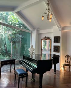 a grand piano in the middle of a living room