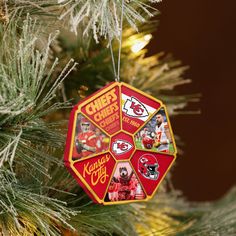 a christmas ornament hanging from a tree decorated with pictures of kansas chiefs and football players