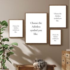 three framed posters on the wall above a crib with a potted plant next to it