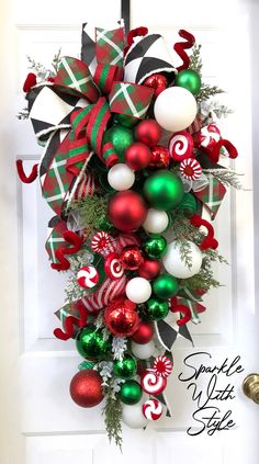 a christmas wreath hanging on the front door