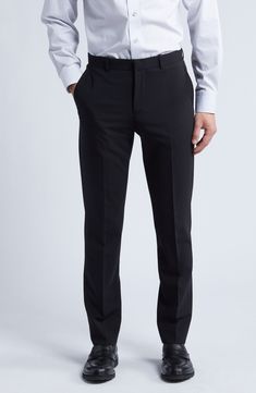 Smart and versatile, these dress pants tailored from polished wool feature a touch of stretch to keep you moving comfortably at any formal occasion. 36 1/2" inseam; 15" leg opening; 9 1/2" front rise; 15" back rise (size 30) Zip fly with hook-and-bar closure Front slant pockets 96% wool, 4% elastane Dry clean Imported Black Semi-formal Flat Front Dress Pants, Semi-formal Wool Flat Front Dress Pants, Black Semi-formal Dress Pants With Welt Pockets, Balck Dress, Black Non-stretch Straight Leg Dress Pants, Black 4-way Stretch Dress Pants, Black Suit Pants, Black Dress Pants Men, Radium Girls