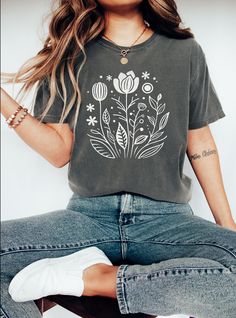 This floral design t-shirt exudes a laid-back and comfortable vibe, perfect for daily wear or casual outings. Ideal for those who appreciate a touch of nature in their wardrobe, making it a great addition for nature lovers and garden enthusiasts. Perfect for holidays like Mother's Day or birthdays. Product features - Available in multiple sizes from S to 4XL for the perfect fit - Double-needle stitching for durability - Without side seams for a clean look - Garment-dyed fabric for a soft texture - Made with 100% ring-spun US cotton for comfort Care instructions - Machine wash: cold (max 30C or 90F) - Do not bleach - Tumble dry: low heat - Iron, steam or dry: low heat - Do not dryclean Trendy Spring Tops With Plant Print, Trendy Plant Print Tops For Spring, Trendy Tops With Plant Print For Spring, Trendy Crew Neck Tops With Plants Print, Casual Floral Print Crew Neck T-shirt, Casual Short Sleeve Tops With Plant Print, Botanical Style Screen Print Tops For Spring, Botanical Screen Print Tops For Spring, Casual Crew Neck Top With Plants Print