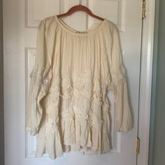 Beautiful And Romantic Flowy Lace Detail Top. Purchased At Anthropologie And Never Worn. Lace Details On Sleeve As Well As Bodice Of Top. Ruffle Style Bottom Hem. Scoop Neck. Cream Long Sleeve Peasant Top For Daywear, Beige Long Sleeve Peasant Top For Daywear, Long Sleeve Beige Peasant Top For Daywear, Beige Long Sleeve Lace Top For Summer, Summer Feminine Long Sleeve Lace Top, Long Sleeve Bohemian Cream Blouse, Feminine Long Sleeve Lace Top For Summer, Bohemian Cream Long Sleeve Blouse, Lace Long Sleeve Blouse For Brunch