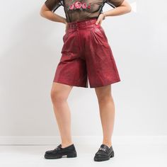 Vintage super high waist leather shorts in red - pleated front - belt loops - zip fly - lined - 2 pockets - materials: genuine leather SIZE from the label: 36 Best fits women: S/M MEASUREMENTS waist circumference: 27.5 inches (70 cm) hips circumference: 42.5 inches (108 cm) rise: 14.5 inches (37 cm) length: 23 inches (58 cm) inseam: 9.5 inches (24 cm) The model is 5'9" (174 cm), measures 35-27-38 (89-69-96 cm) and typically wears clothing in size M CONDITION - 9/10 - The shorts in great pre-owned vintage condition. Washed, ready to wear High-waisted Leather Shorts With Belt Loops, Leather High-waisted Shorts With Belt Loops, Trendy High-waisted Leather Shorts, Red Shorts With Belt Loops, Red Bottoms With Belt Loops And Short Length, Leather Shorts With Belt Loops For Fall, Fall Leather Shorts With Belt Loops, High Waist Red Shorts For Fall, Red High Waist Leather Pants For Spring