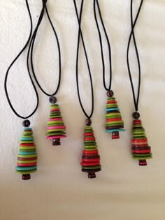 three necklaces with different colored strips on them