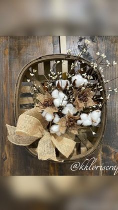 a basket filled with cotton flowers and burlocks