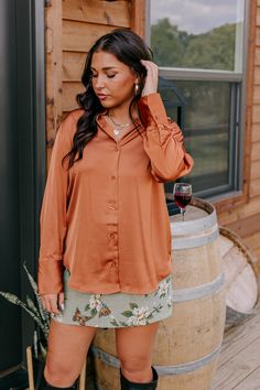 - This versatile top is perfect for a stylish look day or night! - Unlined material with a satin finish - A collared v-cut neckline - A button-up front - Long, loose sleeves with button closure cuffs - A relaxed silhouette that ends in a rounded hemline Measurements S : Bust 38", Hip 42", Length 27.5", Sleeve Length 28", Waist 38". M : Bust 40", Hip 44", Length 28.5", Sleeve Length 29", Waist 40". L : Bust 42", Hip 46", Length 28.5", Sleeve Length 29.5", Waist 42". Loose Sleeves, On Repeat, V Cut, V Cuts, Women Clothing Boutique, Online Womens Clothing, Distressed Jeans, Satin Finish, High Waist Jeans