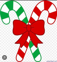 two candy canes with bows clipart - christmas decorations png image transparent background