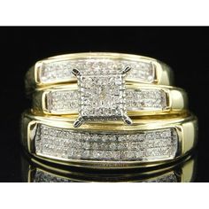 two gold wedding rings set with princess cut diamonds on each band and matching bands for the ring