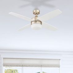 a ceiling fan in a white room