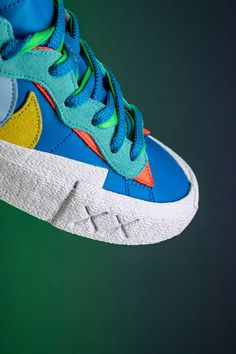 The recent run of three-way sneaker collaborations has been fueled by the contingency of high fashion brand Sacai, famed artist Kaws, and Nike. Each entity brings its signature design elements to the Blazer Low seen here. Retro Nike Custom Sneakers With Contrast Sole, Sporty Multicolor High-top Sneakers With Gum Sole, Kaws Blue, Nike X Sacai, Nike Blazers, High Fashion Branding, Nike Blazer Low, Blazer Low, Character Animation