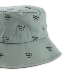 The Ultimate Blend of Sun Safety and Toddler-style Swagger This Toddler bucket hat is the ideal choice for keeping your little one protected from the sun while ensuring he or she looks adorable. The "Shaka Brah" print adds a playful, tropical touch. It’s the perfect accessory for beach outings, park adventures, or simply soaking up the sunshine. This bucket hat will stay securely in place while keeping your toddler cool and shaded. Designed in Hawaii Lined Embroidered Shaka Sign Toddler Size Adjustable Cotton Bucket Hat For Summer, Adjustable Summer Bucket Sun Hat, Summer Bucket Sun Hat For Outdoor, One Size Fits Most Bucket Sun Hat For Play, Adjustable Fit Green Hat For Beach, Cute Adjustable Sun Hat With Uv Protection, Green Sun Hat With Uv Protection And Adjustable Fit, One Size Fits Most Summer Play Hat, Fun Bucket Hat For Playtime