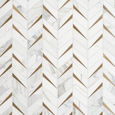 white and gold herringbone marble tile with metallic lines