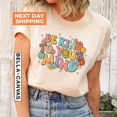 "Be Kind To Your Mind Shirt, Mental Health Gift, Inspirational Shirt, Mental Health Shirt, Therapist Shirt, Mental Health Awareness  Hi!  Welcome. It's great to see you here! ☺️ Our shirts are clean, high quality and soft. It is prepared quickly by our boutique.  Ironing and shipped.  Enjoy your shopping! It is a pleasure for us to help you with your questions and you can reach us at any time. Please, don't forget to check our size cards. HOW TO ORDER SHIRT 👕 Please, choose your favorite t-shirt color and size from the pop-up window. Select the quantity that you want. Click \"ADD TO CART\". You can go back to add more product color  for your loved ones members. You can complete the checkout process. Please \"Click Proceed to Check Out\" Finally, you have completed all the steps, your prod Multicolor Cotton Slogan Shirt, Multicolor Cotton Shirt With Slogan, Teacher Mental Health, Mental Health Shirts, Be Kind To Your Mind, School Psychologist, Inspirational Shirt, Be Kind To Yourself, Health Awareness