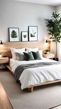 a large bed sitting in a bedroom next to two planters on either side of the bed