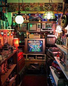 a room filled with lots of different types of electronic devices and electronics on top of shelves