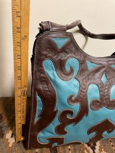 Leaders in Leather Beautifully Cutout Tooled Shoulder Bag - Etsy Turquoise Hand Tooled Rectangular Shoulder Bag, Hand Tooled Blue Bags For Daily Use, Hand Tooled Blue Bag For Daily Use, Blue Hand Tooled Bags For Daily Use, Blue Hand Tooled Rectangular Shoulder Bag, Blue Rectangular Hand Tooled Shoulder Bag, Turquoise Hand Tooled Bag, Blue Leather Artisan Shoulder Bag, Artisan Blue Leather Shoulder Bag