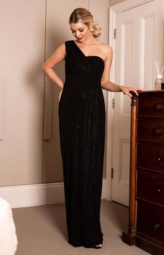 Deep black with a hint of sparkle gives this dramatic one shoulder asymmetric maternity gown true movie star appeal. With a gathered sweetheart bodice and faux-wrap skirt, the Galaxy is designed to fit and flatter and make the most of your pregnancy curves. Ideal for the most special of occasions, whether it be a formal wedding, charity ball or black-tie event, the Galaxy is maternity glamour at its finest. Full length maternity gown Black with hint of silver sparkle One shoulder, asymmetric des Maternity Ball Gowns, Maternity Occasion Dress, Maternity Wedding Dresses, Charity Ball, Galaxy Dress, Maternity Wedding, Tiffany Rose, Maternity Bridesmaid Dresses, Preggo Fashion