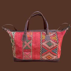 You're going to want to plan a weekend trip just so you can use this beautiful bag! Intertwined's beautifully crafted travel bag is handmade in Morocco from locally tanned leather and vintage, handwoven kilim. Each kilim is one-of-a-kind and handwoven with unique colors and patterns based on the region where it is made. Handwoven Brown Travel Bag, Multicolor Woven Leather Travel Bag, Traditional Travel Bag With Woven Motifs, Artisan Travel Bag With Woven Motifs, Vintage Tapestry Travel Bag, Moroccan Leather, Leather Artisan, Garbage Bag, Weekend Trip