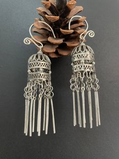 One Pair Hmong Silver Earrings,Vintage Earrings,Lantern Design,Miao Silver ,Tribal Jewelry ,Boho Style. This earrings is handmade craft by our family lived in minority area Southwest of China. It's very unique. Also can bring you much luck. It's special workmanship. It can be a special gift. Width: 2cm Height:5cm Weight: 10g Care Instruction:  ❥. Avoid wearing the same miao silver jewelry for a long time.Take off your jewelry before bathing or swimming. ❥. Miao silver jewelry should avoid rubbing against each other and scratch the flower surface. ❥. Use soft brush or cotton cloth to wipe the surface of jewelry, so as to remove surface stains. ❥. When not wearing, it should be sealed and packed to reduce contact with air and avoid oxidation of miao silver jewelry. ❥. When there is oxidation Miao Silver, Vintage Earring, Lantern Design, Silver Ornaments, Jewelry Boho, Boho Stil, Earrings Vintage, Vintage Earrings, Boho Style