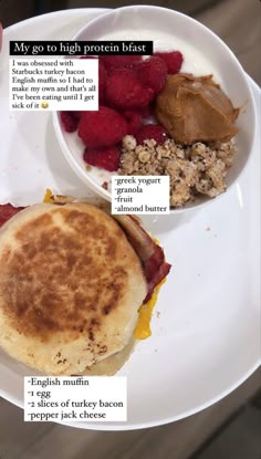 a white plate topped with breakfast foods on top of a table