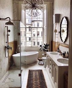 a bath room with a tub a sink and a mirror on the wall in front of a window