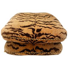 two brown and black pillows on top of each other