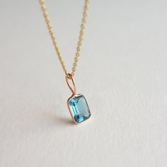 ✪Gold weight: 440 milligram ✪Stone size: 7x5 mm ✪Bail size: 5 mm ✪Total length: 14 mm ✪Metal: 18k solid rose gold ✪Gemstone: Swiss blue topaz ✪Setting type: Bezel setting If you need any other preferred stone please contact us. QUALITY OF MATERIALS: Metal: Most of our jewelry at JewelryMansion is made with precious metals like gold and silver. These metals are 100% non-allergic to our skin. Gemstone: All of our jewelry is made by handpicked gemstones. Due to the nature of these gemstones a slight variation in colors may be noticed between the pictures and the real piece. Although we guarantee that this is barely noticeable. Real gemstones naturally consists of inclusions. In other words these gemstones may have very small barely noticeable cracks trapped inside the stones. This characteris Rectangular Blue Topaz Jewelry Gift, Gift Blue Topaz Rectangular Jewelry, Minimalist Topaz Jewelry As A Gift, Emerald Cut Blue Topaz Yellow Gold Jewelry, Blue Topaz Octagon Jewelry Gift, Octagon Blue Topaz Jewelry Gift, Octagon Blue Topaz Jewelry As A Gift, Octagon Shaped Blue Topaz Jewelry Gift, Emerald Cut Topaz Birthstone Jewelry