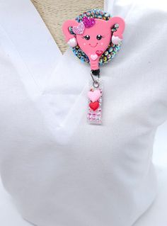 The uterus shaker badge reel is perfect for anyone working in OB\GYN. A light pink color with pretty little flowers on top! The best part is, it is a shaker and comes in 3 different colors. She is perfect for any nurse, CNA, doctors, or anyone in scrubs! The long cord gives you the flexibility to badge in and out without removing your badge! With the cord tested up to 100,000 pulls, it gives you one less thing to worry about and more time to focus on patient care! STYLE OF REEL The uterus badge Adjustable Novelty Pink Badge Holders, Cute Pink Badge Holders For Gift, Cute Pink Badge Holders As Gift, Cute Pink Badge Holder As Gift, Novelty Personalized Pink Badge Reel, Novelty Pink Personalized Badge Reel, Personalized Pink Novelty Badge Reel, Pink Personalized Novelty Badge Reel, Personalized Pink Novelty Badge Holders