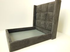 an upholstered bed frame with no mattress