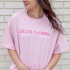 Your summer nights just got cuter! This classic tee is perfect for long nights under the stars or days on the boat. This tee will have your sorority name embroidered in the thread color of your choice and the city and state will be embroidered in white. Thread color will be for the sorority - the city and state will be in white no matter what shown in light pink and cornsilk 6 oz.(US) 10 oz.(CA), 100% preshrunk cotton Classic fit 7/8" double-needle topstitched collar Taped neck and shoulders Dou Pink T-shirt With Embroidered Text For Summer, Pink Embroidered T-shirt For Summer, Pink Sorority T-shirt For Summer, Sorority Cotton T-shirt For Spring, Spring Sorority Cotton T-shirt, Sorority Style Cotton T-shirt For Spring, Pink Embroidered Text T-shirt For Summer, Pink Sorority T-shirt For Spring, Summer Sorority Cotton T-shirt