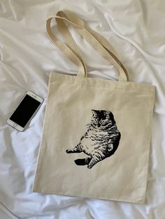 Fat Cat Tote Bags! Ships within 1-2 days for a speedy delivery every time Organic cotton totes See photos for sizing reference Everyday Cotton Bags With Cat Print, Cotton Bag With Cat Print, Rectangular Shape, Cotton Bags With Cat Print For Everyday Use, Cotton Tote Bag With Cat Print, Cotton Cat Print Bags For Everyday Use, Casual Cotton Bag With Cat Print, Rectangular Cotton Bag With Cat Print, Cotton Cat Print Rectangular Bag, Rectangular Cotton Bag With Cat Design