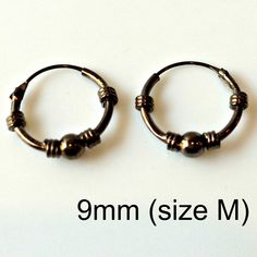 These mesh wire earring hoops are made from sterling silver and plated with black gold. Other wire hoops design available. Please browse through the link below. SPECIFICATION Base metalRecyclable fine 925 Sterling Silver Outer LayerPlated with Black Gold Inner Diameter9 mm (Size M) Available in 2 colors: Black Gold Plating Rose Gold Plating ▶ Shipping, Custom Orders, and Return Policy We use 3-day USPS delivery service and often get praise for our fast shipment and professional packing. Full ref Classic Adjustable Hoop Earrings, Classic Adjustable Hoop Earrings For Pierced Ears, Adjustable Small Hoop Classic Cartilage Earrings, Classic Nickel-free Hoop Piercings, Classic Adjustable Round Cartilage Earrings, Adjustable Classic Round Cartilage Earrings, Classic Adjustable Hoop Cartilage Earrings, Classic Adjustable Nickel-free Cartilage Earrings, Adjustable Nickel-free Round Huggie Earrings