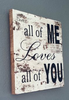 a wooden sign that says, all of me loves all of you on the wall