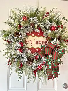 a christmas wreath hanging on the front door