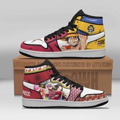 one piece shoes with anime characters painted on the upper and bottom, sitting on top of a cardboard box