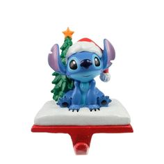 a christmas ornament with a blue and red hat on it's head