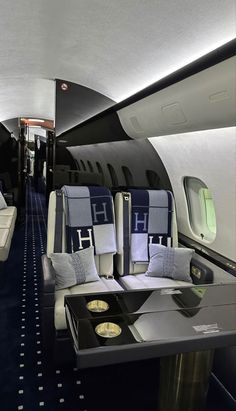 the inside of an airplane with seats and trays