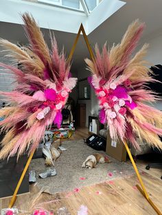 two pink and gold feathers are on display in the living room