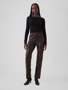 Fit: A full-length classic straight-leg pant that's slim through the hip & thigh.  Fabric: 100% Recycled Polyester.  Stretch: No-Stretch Pants.  Rise: High Rise Jeans.  Look: A classic five-pocket jean in vegan leather.  Details: Zip fly & five-pocket styling.  Responsibly Made: This vegan leather pant is made with 100% recycled polyester.  Compared to virgin materials, using recycled materials helps to reduce resource use and waste.  Our High Rise Jean has an 11" 28 cm) rise. ​ Slim through the hip & thigh.  Straight leg.  Full-length jean.  Hits below the ankle.  Inseam: Short 29" 73. 5 cm), Regular 30. 5" 77), Long 32. 5" 82. 5 cm).  Models wearing Gap 90s Fits, Toddler Jeans, Leather Pant, Straight Trousers, Leather Trousers, Straight Leg Trousers, Stretch Pants, High Rise Jeans, Straight Pants