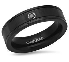 Elevate your style with this black cubic zirconia ring, a bold statement of sophistication and strength. Its sleek black ion-plated stainless steel band, accented with a flush-set black cubic zirconia, offers a modern twist on classic elegance. Perfect for any occasion, this ring is a testament to the confident man who wears it. From Steel by Design® Jewelry. Modern Black Tungsten Carbide Jewelry, Confident Man, Cubic Zirconia Rings, Design Jewelry, Stainless Steel Band, Elevate Your Style, Classic Elegance, Cubic Zirconia, Jewelry Rings