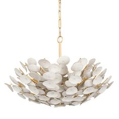 a white chandelier hanging from a gold chain