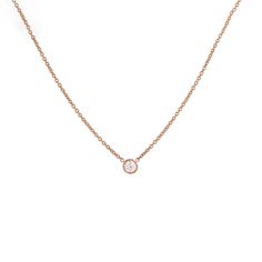 Our classic 14k gold pendant necklace features a solitaire round brilliant diamond, bezel set and suspended from a dainty chain - a subtle yet timeless sparkle from Gilded by G.St. Able to special order in rose or white gold- please allow 5 weeks for production and delivery. • 14k gold• 0.20ct round brilliant diamond (G-H color, SI clarity)• Spring ring clasp• Length: 16-17" All G.St collections are designed and crafted by us in NYC using recycled gold, conflict-free diamonds and responsibly sou Rose Gold Solitaire Round Cut Necklace, Dainty Solitaire Necklace With Bezel Setting For Formal Occasions, Delicate Rose Gold Solitaire Necklace For Formal Occasions, Minimalist Necklace With Smooth Bezel For Anniversary, Rose Gold Diamond Necklace With Single Round Cut, Rose Gold 14k Single Diamond Necklace, Elegant Solitaire Necklace For Anniversary With Smooth Bezel, Fine Jewelry White Gold Solitaire Necklace With Smooth Bezel, Rose Gold Round Diamond Necklace With Single Diamond