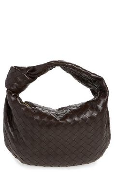 The house's iconic intrecciato weave, crafted from handwoven strips of lambskin leather, textures this softly structured hobo with a knotted shoulder strap. Top zip closure Shoulder strap Lined Leather Made in Italy Designer Handbags Elegant Brown Intrecciato Weave Hobo Bag, Designer Woven Leather Hobo Bag, Designer Leather Hobo Bag With Woven Detail, Chic Brown Hobo Bag With Intrecciato Weave, Luxury Woven Hobo Bag, Luxury Hobo Bag With Interwoven Design, Designer Leather Hobo Bag With Intrecciato Weave, Woman Bags Handbags, Strap Top