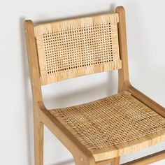 a wooden chair with woven seat and back